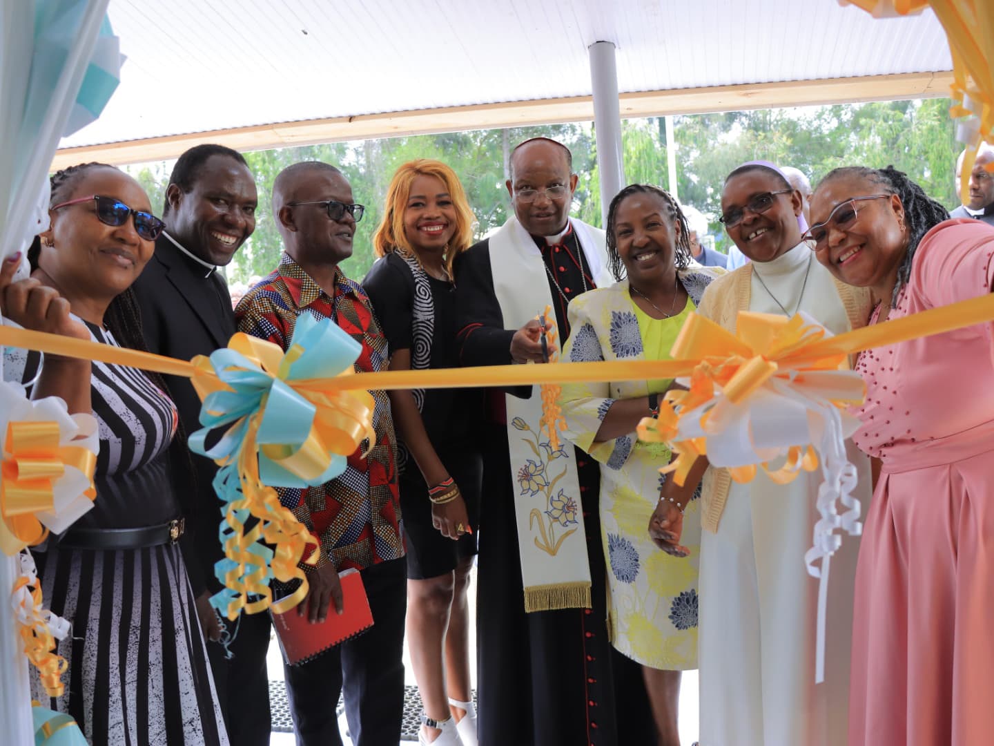 Archbishop Muheria cuts the ribbon at the Tumaini Autism Centre grand opening